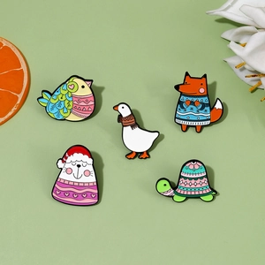 Detailed view of five cartoon animal enamel pins including fox, goose, and turtle