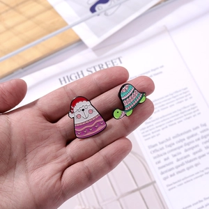 Cartoon animal enamel pins set featuring a festive seal and colorful turtle for clothes