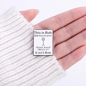 Creative This is Bob enamel pin badge with funny stick figure on a white knit sweater