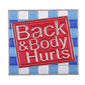 Square enamel pin with red Back & Body Hurts text and blue mosaic pattern background