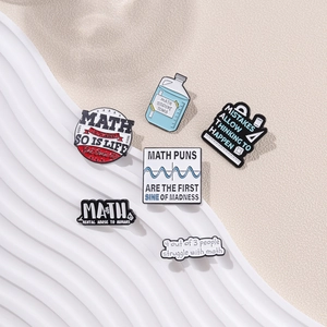 Creative math themed enamel brooch set with milk bottle and formula pins on sand