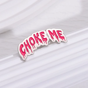 Pink dripping enamel pin featuring CHOKE ME text with polished silver metal finish