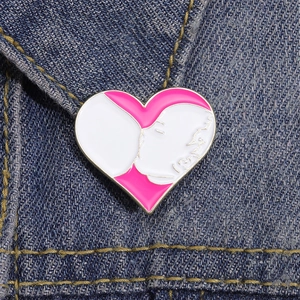 Pink heart enamel brooch for Mother's Day featuring a mother and baby nursing scene
