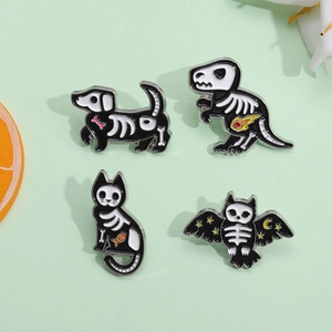 Halloween enamel pin set featuring animal skeletons of dog, cat, and dinosaur