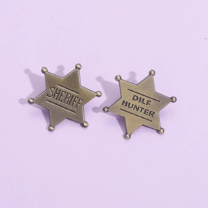 Vintage bronze hexagram star badges featuring Sheriff and DILF Hunter engraved text