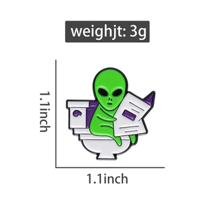 Funny alien enamel pin on white toilet reading purple newspaper 1.1x1.1 inch detail