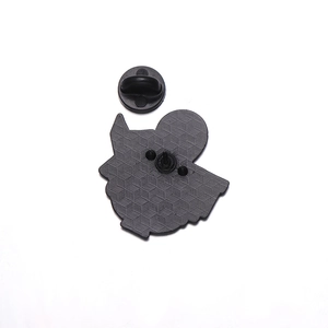 Detail view of the textured alloy back and black rubber clutch for the alien enamel pin