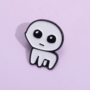 Minimalist white enamel TBH creature brooch pin featuring a cute cartoon creature on purple