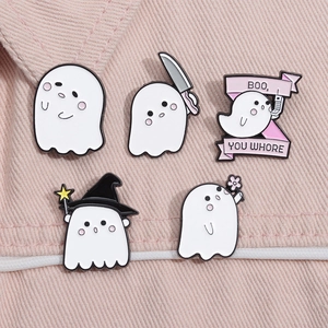Set of five cute cartoon ghost enamel pins with funny Halloween themes on pink background