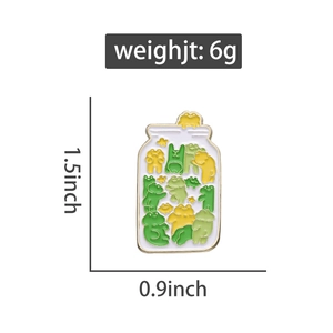 Enamel pin dimensions of a jar filled with frogs showing 1.5 inches height and 6g weight