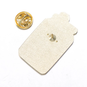 Detailed macro view of the gold-plated metal pin back and butterfly clasp accessory