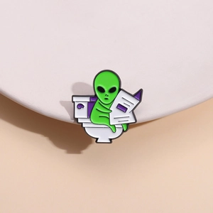 Funny green alien sitting on toilet reading newspaper creative enamel brooch pin