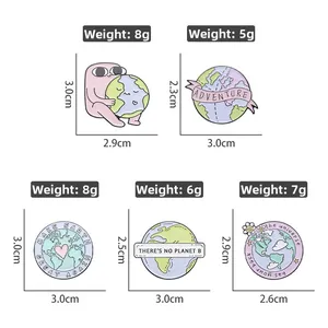 Close-up of five colorful eco-friendly enamel pins with weights and sizes for Earth Day