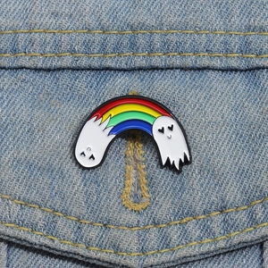 Rainbow enamel brooch with two white ghosts on denim jacket for Halloween decor