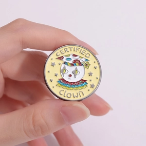 Cartoon geometric clown enamel pin badge with glitter details and star-shaped eyes