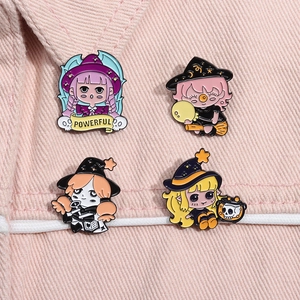 Detail of four magical girl enamel pins pinned on light pink denim fabric texture
