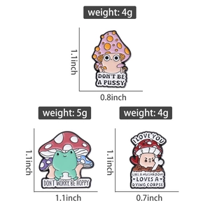 Detail showing dimensions of cute mushroom and frog enamel pins with bright colors