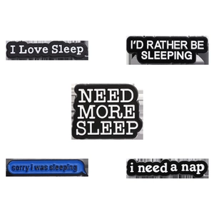 Enamel lapel pin set featuring I Love Sleep and I Need A Nap phrases on white background