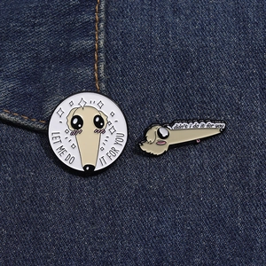 Detail of Borzoi dog enamel pins set on denim fabric featuring Let Me Do It For You text