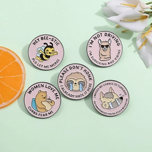 Set of 5 round cartoon animal enamel pins with funny English quotes on green background
