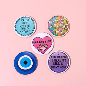 Set of 5 colorful tinplate badges featuring frog art and modern pop culture quotes