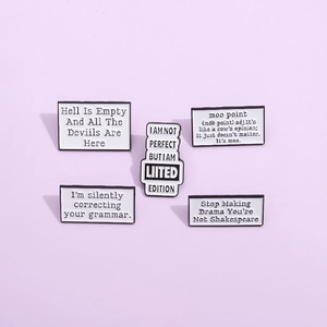 Five unique white enamel pins with black creative text quotes on a soft purple background