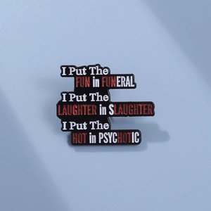 Black enamel pin featuring humorous red and white typography on a minimalist background