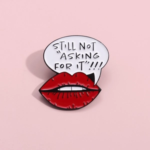 Cartoon red lips enamel pin with 'STILL NOT ASKING FOR IT' quote on pink background