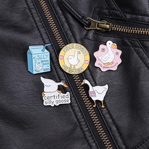 Set of 5 funny enamel pins featuring silly geese and milk cartons on black leather jacket