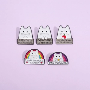 Set of five creative cartoon cat enamel pins with humorous quotes on a purple background