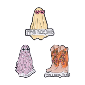 Three-piece enamel pins set featuring cartoon ghosts and floral cowboy boots for fans