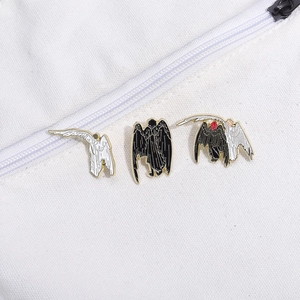 Three-piece black and white angel wings enamel pin set with gold-plated alloy edges