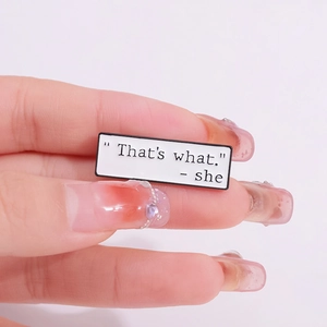 Creative enamel pin with funny quote That's what she said on white rectangle badge