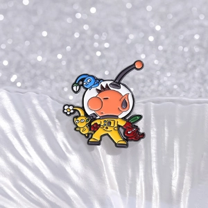 Macro shot of colorful Pikmin enamel pin featuring Captain Olimar and characters