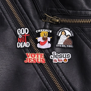 Funny Jesus enamel pins set of 5 on black leather jacket for stylish clothing accessory