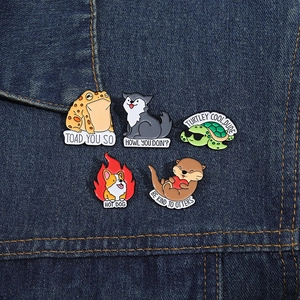 Set of 5 funny animal enamel pins with puns on denim background, cute fashion accessories