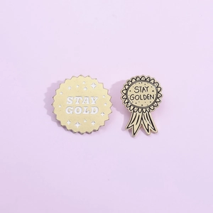 Creative Stay Gold enamel pins with star medal design and polished golden finish