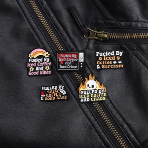 Detailed close-up of five American vintage style enamel pins pinned on a black leather jacket