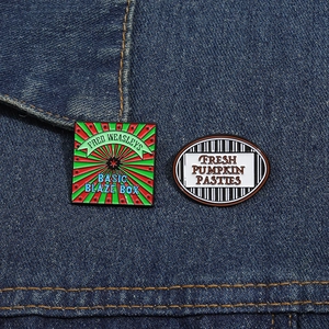 Fred Weasley and Pumpkin Pasties enamel pins displayed on a dark denim jacket