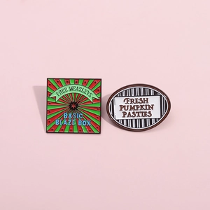 Set of two colorful geometric enamel pins featuring Fred Weasley and Pumpkin Pasties designs