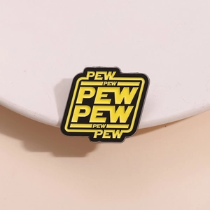 Sci-fi style 'PEW PEW PEW' enamel pin with yellow and black colors on a round stand