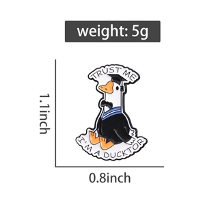 Detailed view of Ducktor enamel pin showing 1.1x0.8 inch dimensions and 5g weight