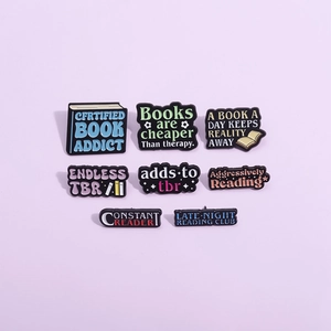 Set of 8 colorful enamel book badges with literary quotes for clothing and bags
