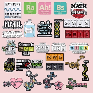 Creative enamel pin set featuring science, math, and chemistry designs on pink background
