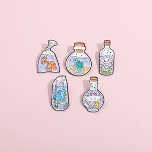 Enamel pins set of ocean animals in glass bottles like whale, turtle and clownfish
