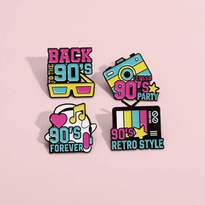 Set of 4 vintage 90s enamel pins featuring a TV, camera, headphones and 3D glasses