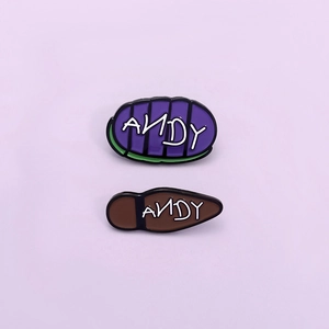 Cartoon Andy enamel pins set featuring purple stripes and brown shoe sole designs