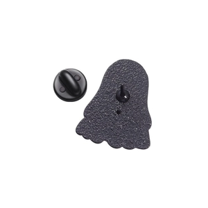 Detail view of the back of a black enamel pin with textured metal and rubber clutch