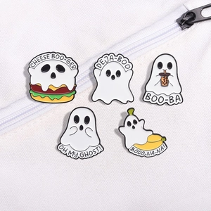 Detail of five cute cartoon ghost enamel pins set on a white canvas bag background
