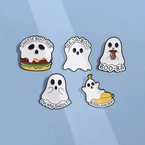 Macro shot of 5 cute enamel pins featuring funny ghost-themed food designs like burgers